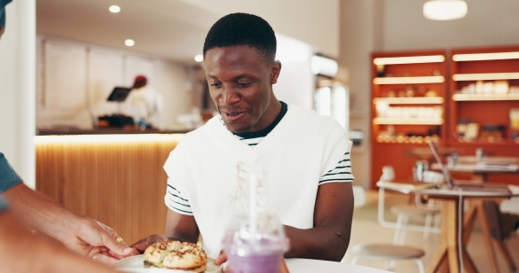Man being served at a fast food restaurant